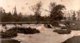 Picture of The River Culm after heavy rain. Taken from the Park, Uffculme, devon. Undated.